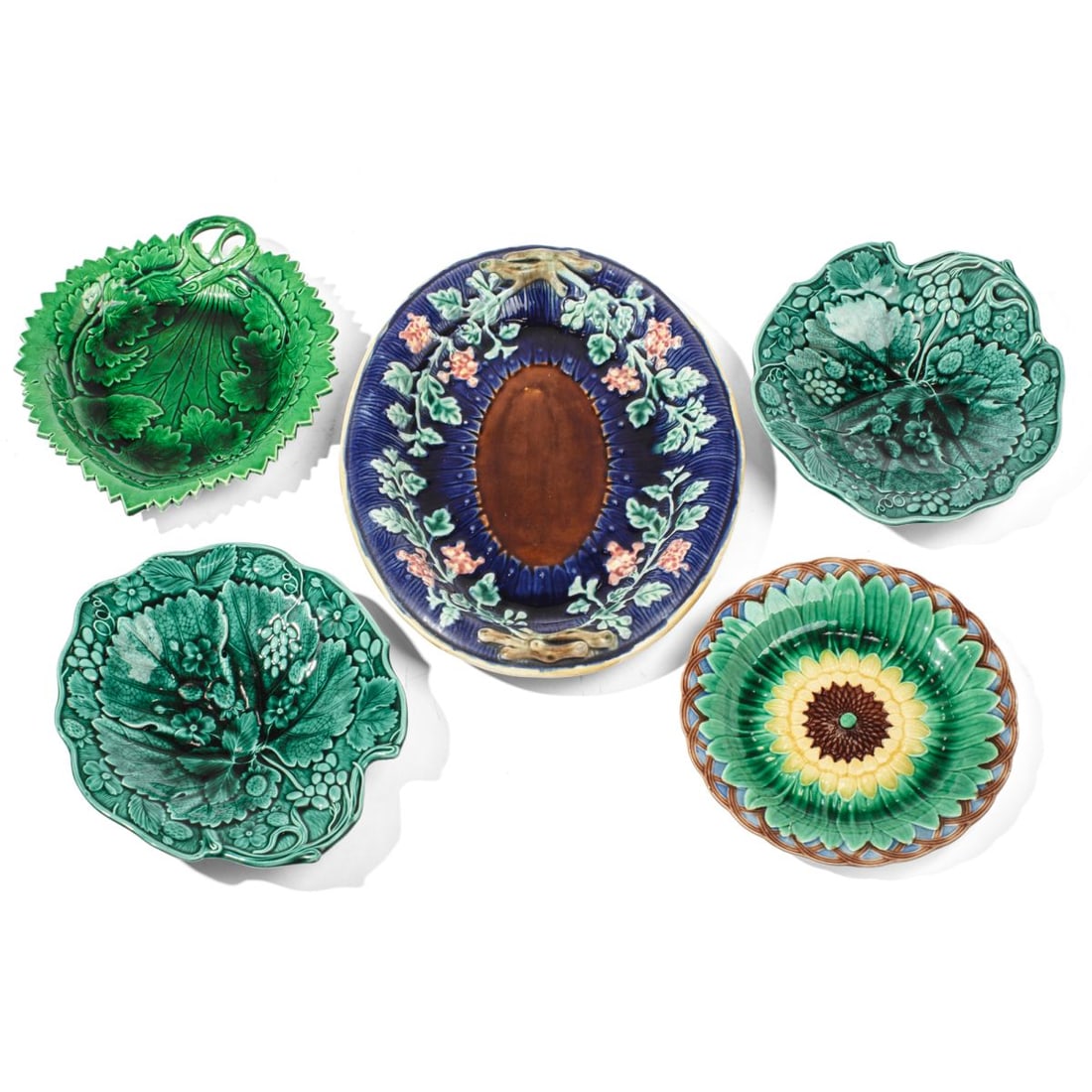 Collection Antique Majolica Plates: Collection of 5 antique majolica plates. (1) Pair strawberry and leaf plates in green. Both very good condition. 9.25" x 8.75". (2) Handled leaf form dish in green. Good condition. 10" x 9". (3) Oval