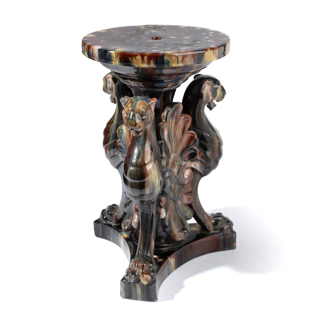 French Clement Massier Griffin Jardiniere Stand: Drip glaze majolica figural griffin jardiniere base by Clement Massier, France. No apparent mark. Glaze use wear to top, a few small chips to plinth base corners; no major cracks or chips. 18.25" H.