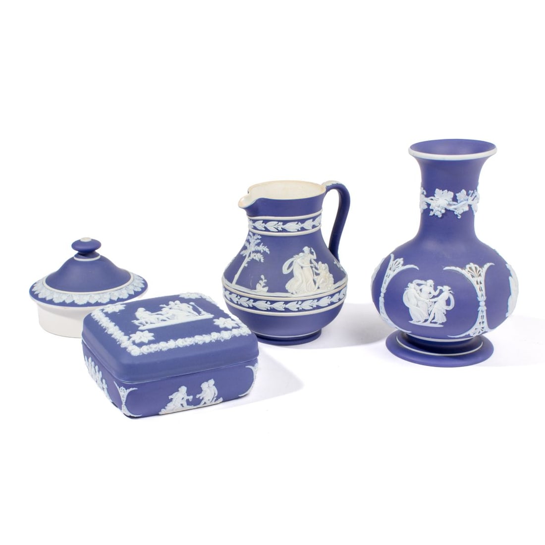 Wedgwood Blue Dip Jasper Box / Vase / Pitcher: Four 20th century Wedgwood blue dip jasperware articles. Includes baluster-form vase, pitcher, lidded box, and lid. Impressed marks. All pieces in very good condition. Largest (vase) measures 6" H.