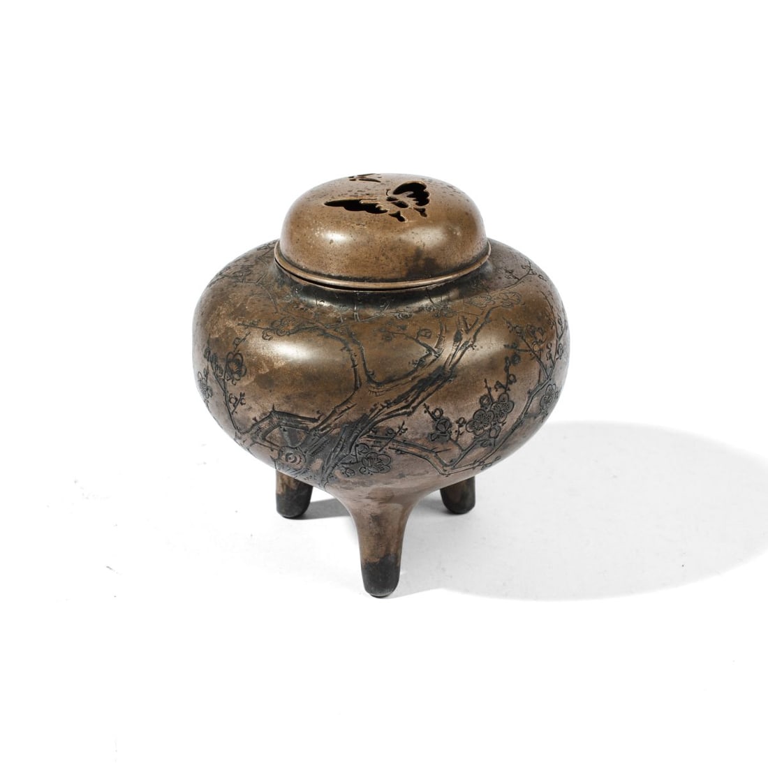 Japanese Silverplate Brass "Plum Tree" Koro: Antique Japanese brass metal tripod koro incense burner with pierced butterly lid, the blody having chased and hammered gnarled plum tree, with inscription in multiple scripts at reverse and two seal 