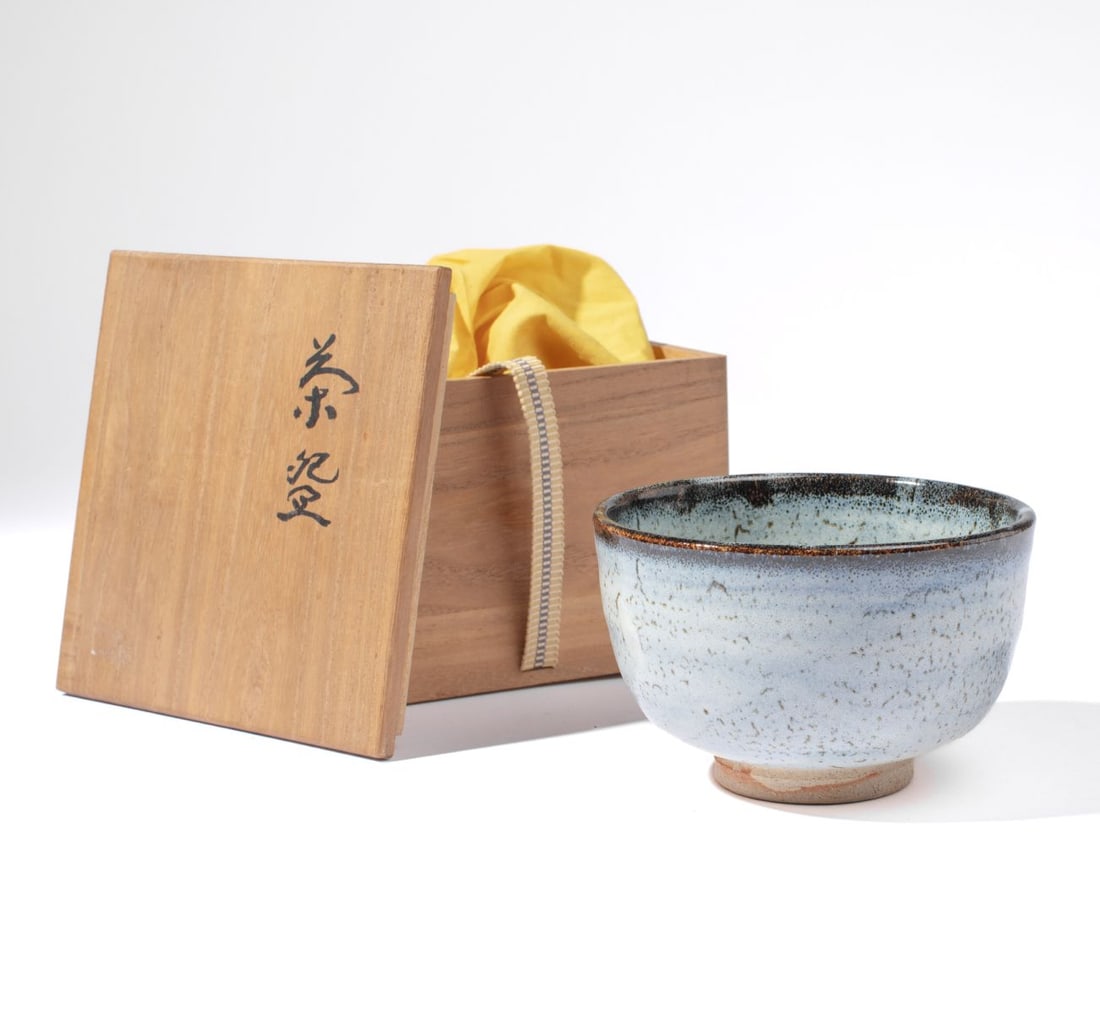 Japanese Chawan Tea Bowl w/ Box: Japanese artist stamped pottery Chawan tea bowl. Two artist stamps above raised foot. Includes original stamped yellow wrapping cloth and inscribed / stamped box. Excellent condition. Bowl 3.25" H x 5