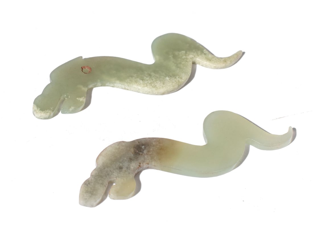 Chinese Neolithic Jade Immature Dragon Carvings: Pair Neolithic (Liangzhu Culture 3300-2200 BCE) jade immature dragon carved plaques from the Cowperthwaite Family Trust Collection. Thinly carved mottled pale green jade; small drilled hole to each. C