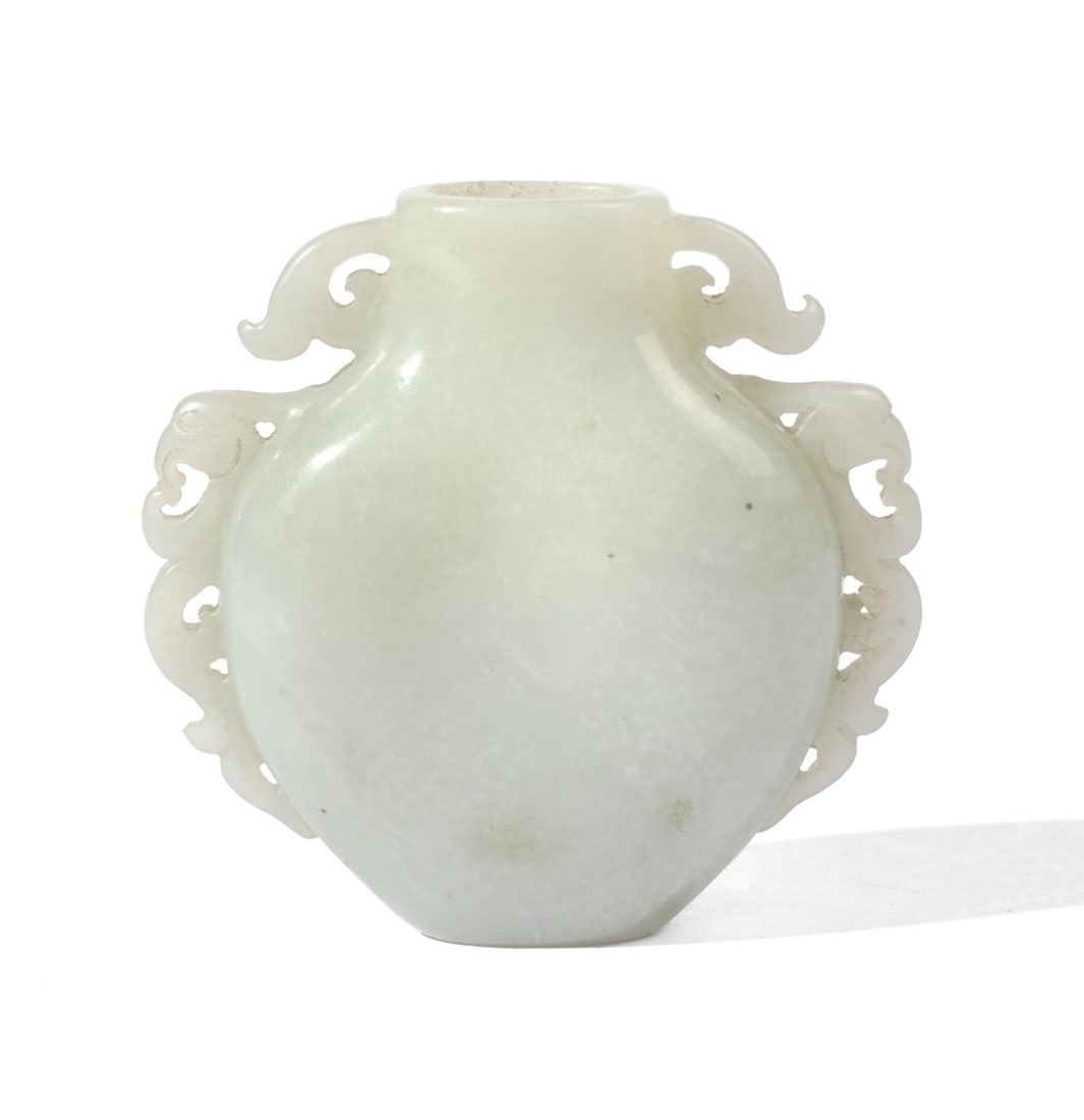 19th C. Chinese Jade Snuff Bottle: 19th century Chinese very pale grey jade snuff bottle with oval opening and dragon flanges at each side. Good condition; does not include lid / spoon. 2 1/8" H x 2 1/4" W approx.