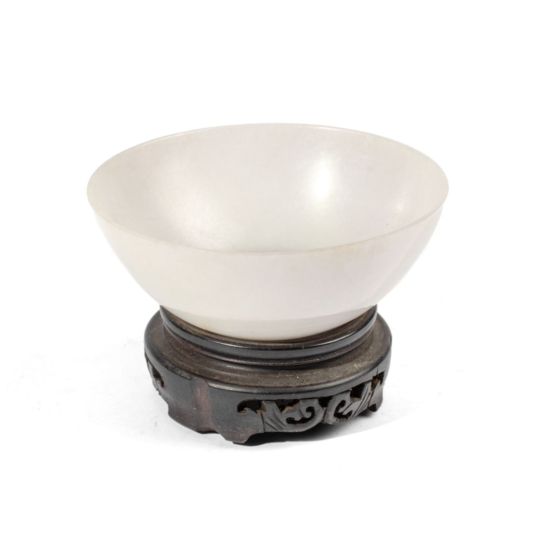 19th C. Chinese Fine White Jade Bowl w/ Stand: 19th century Chinese fine and thinly carved translucent white jade bowl. Provenance: purchased at Bonham's London. Good condition; natural occurring hairline through bowl base. Includes wood stand. 1 