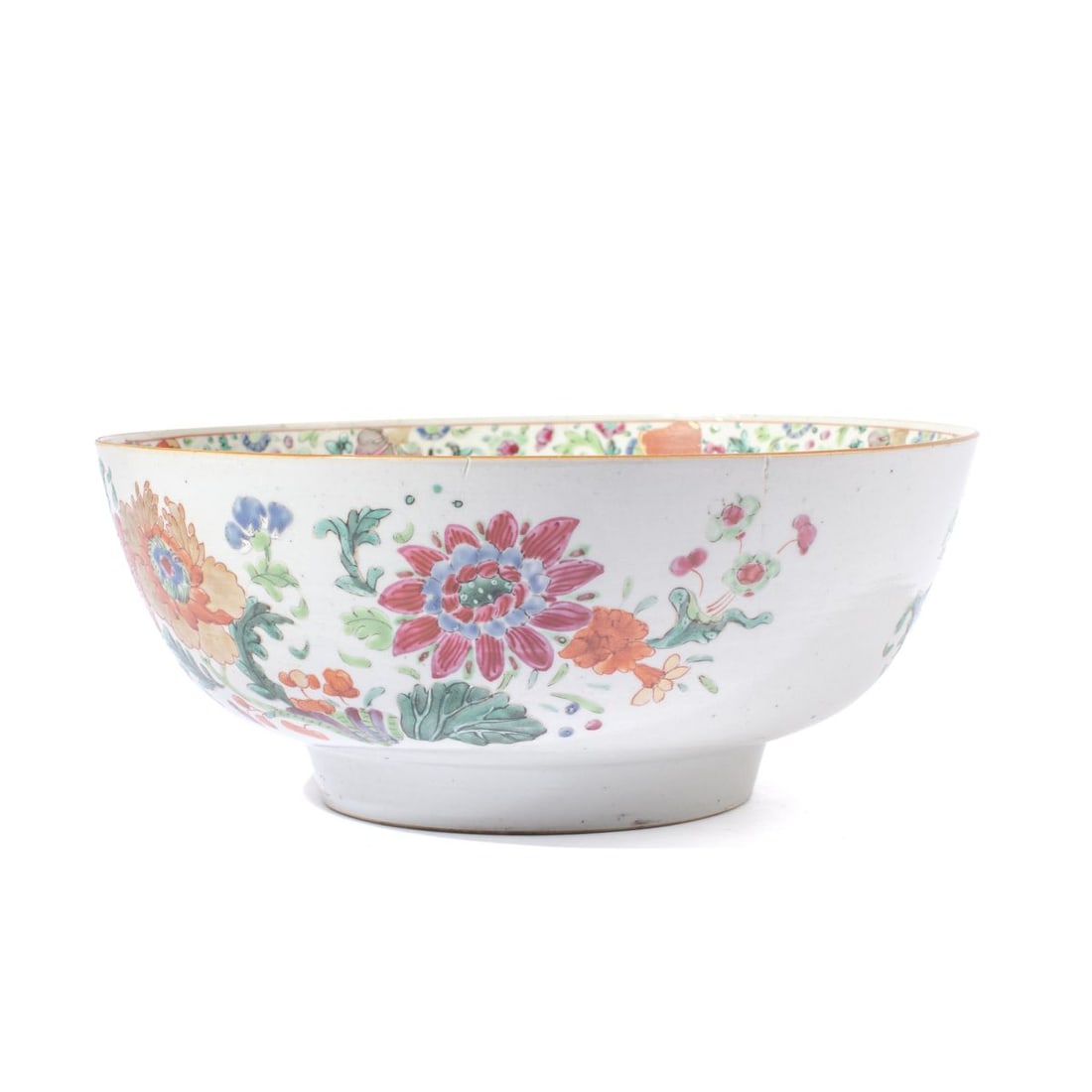 Chinese Qianlong Famille Rose Punch Bowl: Qianlong period (1736-1795) Chinese Famille Rose punch bowl. Floral decorated to the interior and exterior. Four hairline cracks from the rim downward and hairline cracks to the bottom; sold as is. 4.