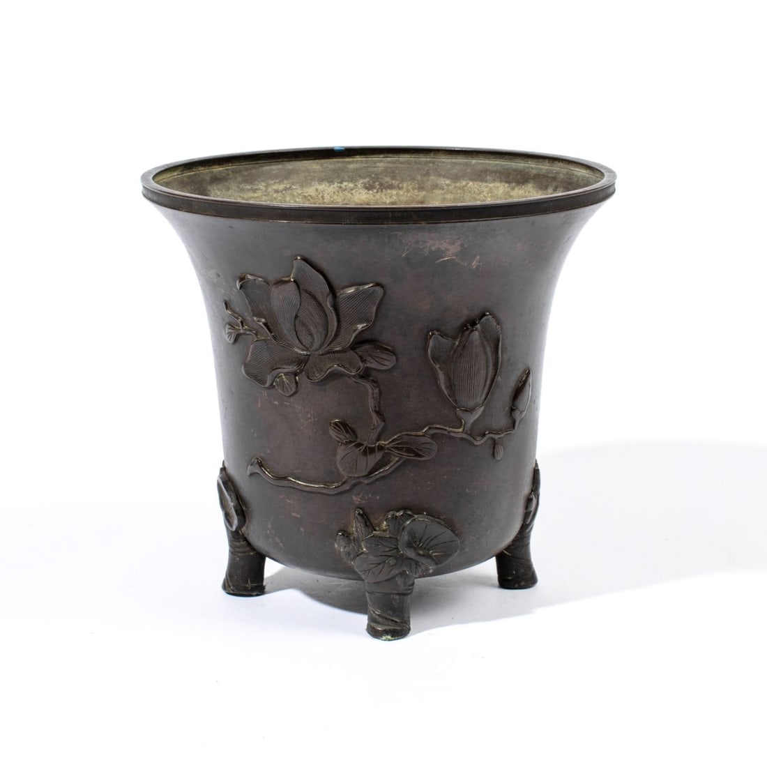 18th C. Chinese Bronze Jardiniere: 18th century (possibly Kangxi) Chinese bronze jardiniere with rasied magnolia design. Four raised feet in flower and stem design. Very good condition; bottom plate unattached. 7 1/4' H x 7 7/8' lip di