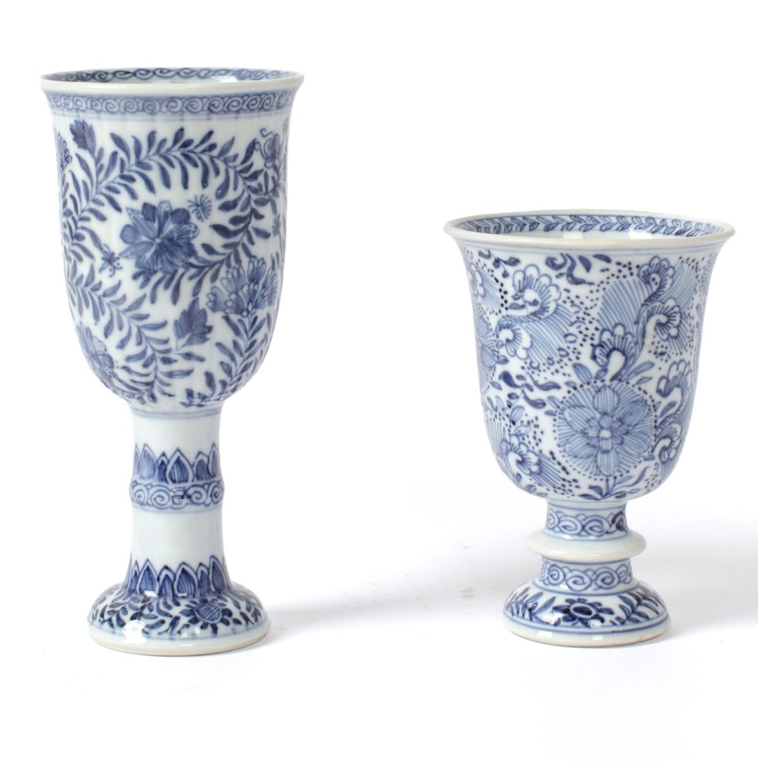 Chinese Kangxi Blue & White European Form Goblets: Two Kangxi Chinese blue and white European form porcelain goblets decorated in intricate floral designs. Both appear in good condition but with restorations under black light per consignor. 6.25" and 