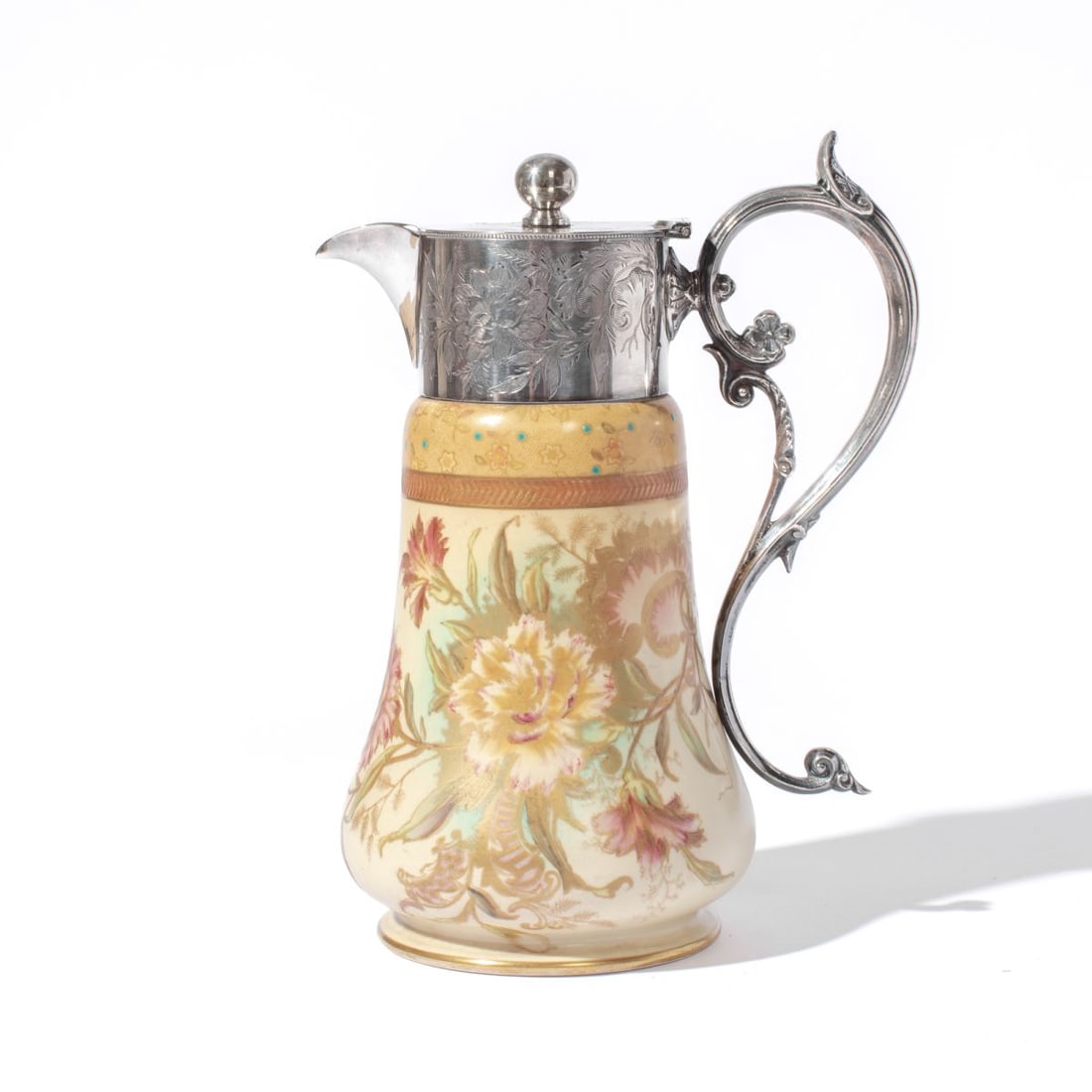 Antique Carlton Ware Claret Jug Pitcher: Circa 1899 / 1900 Carlton Ware "Carnation" pattern claret jug pitcher with engraved silver plate lidded top and handle. Blue Wiltshaw & Robinson mark to underside along with RD No 30945 to bottom.