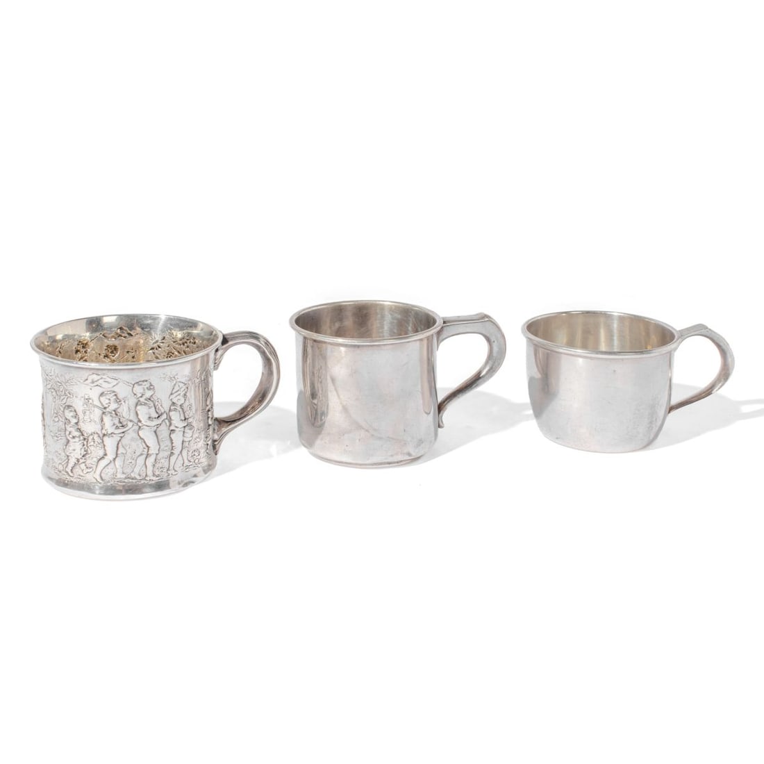 Gorham "Follow the Leader" Sterling Cup A4708: Group of 3 antique sterling silver baby/christening cups. (1) Gorham cup featuring a high-relief "Follow the Leader" or marching boy's parade motif. Engraved "Ernest Hutchinson Menges 1904" to the