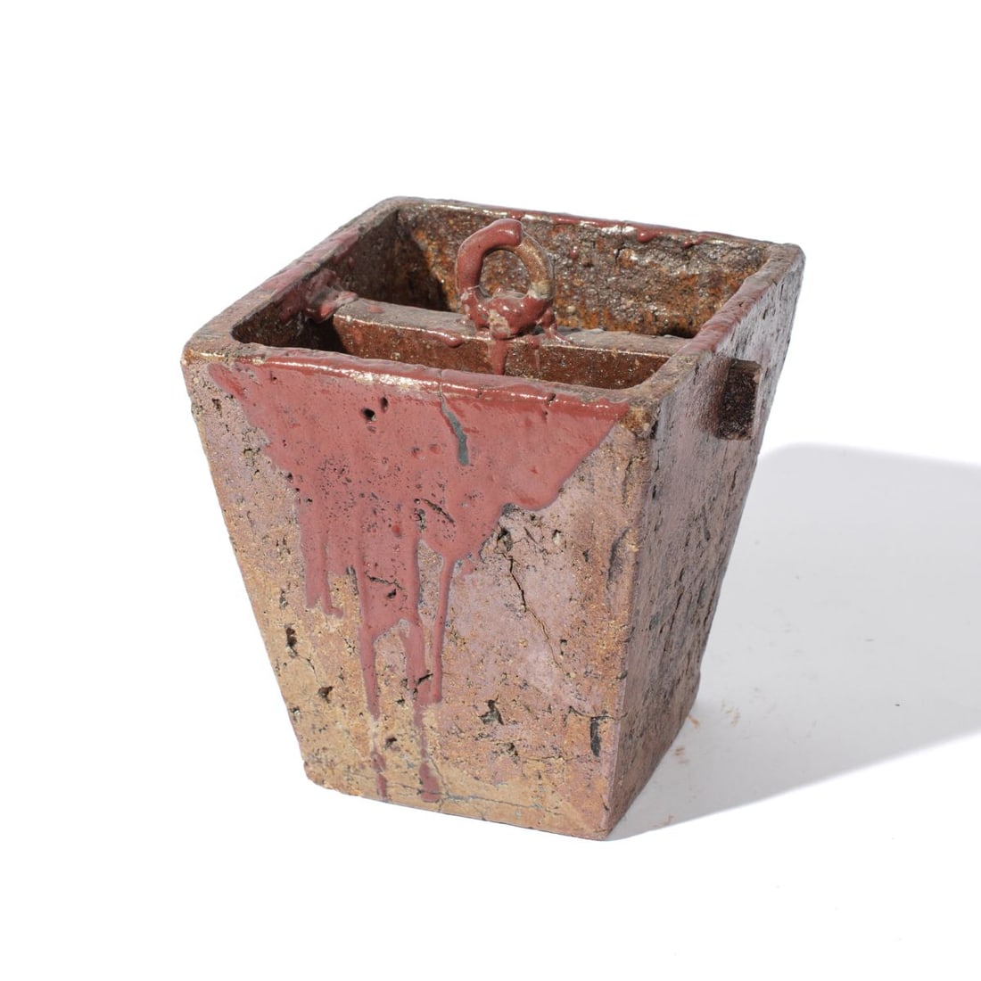 Antique Asian Stoneware Bucket: Antique Asian Stoneware Bucket. Red glaze splashes throughout from use. Illegible inscription on base. Measures 8x7x7". Good condition with wear from use and age.