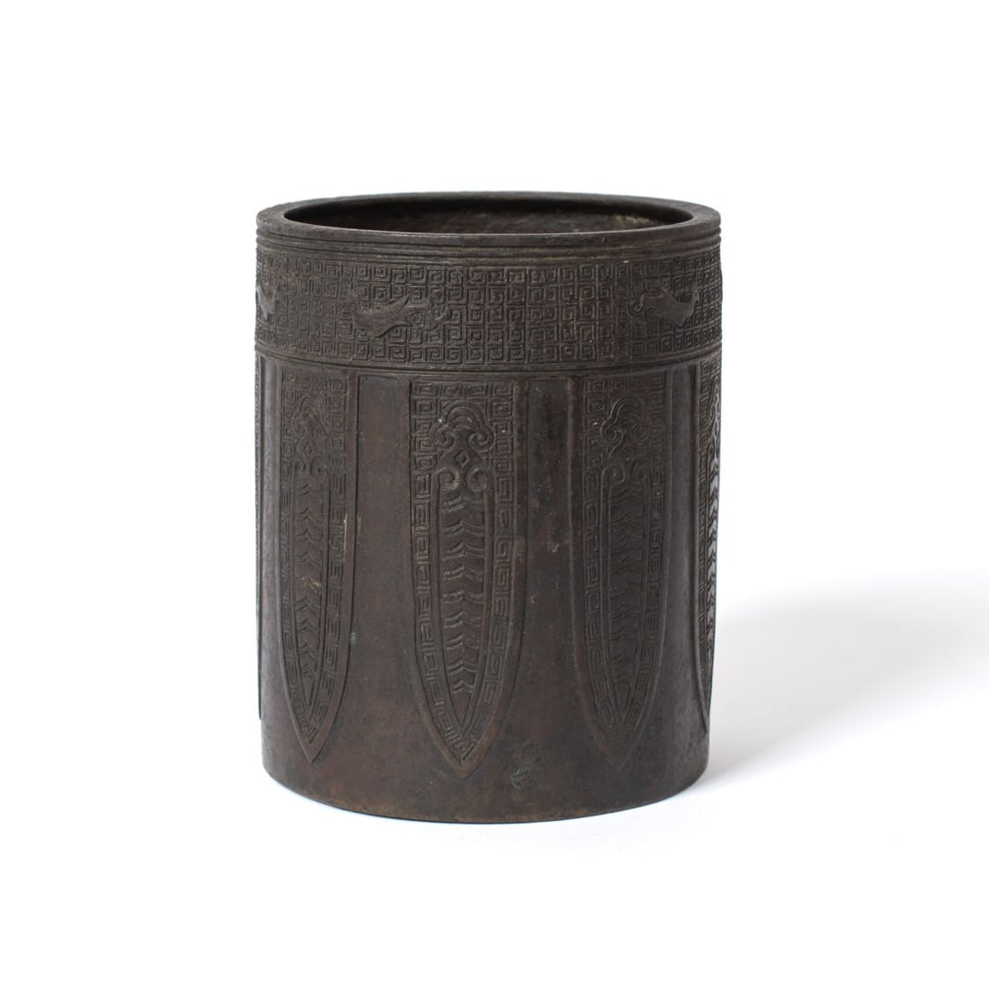 Chinese Archaic Style Bronze Brush Pot: Vintage Chinese bronze brush pot with raised archaic designs. Very good condition with well cast details, aged patina, etc. 5" H x 4 1/8" dia. approx.
