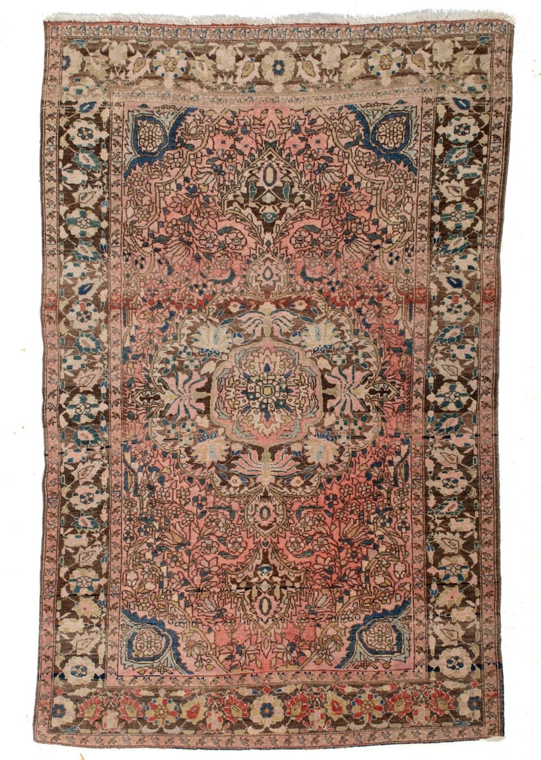 Antique 19th C. Persian Rug: Antique circa 19th century finely hand-knotted wool on cotton Persian rug. Intricate floral design on faded red field around a center medallion. Border ground in brown tones. Worn "Carson Pirie Scott"