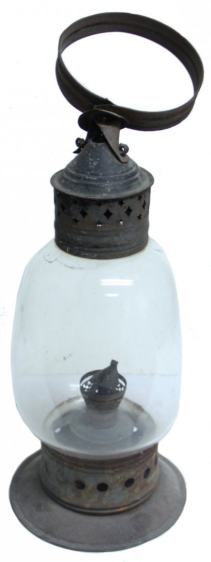 Classic Civil War Lantern: 1860 era oil lamp lantern. Roughly 15 inches tall. Burner and base are secured by two spring clamps on the bottom. Glass globe has a hole broken out. Still solid. It likely had several Wire protective
