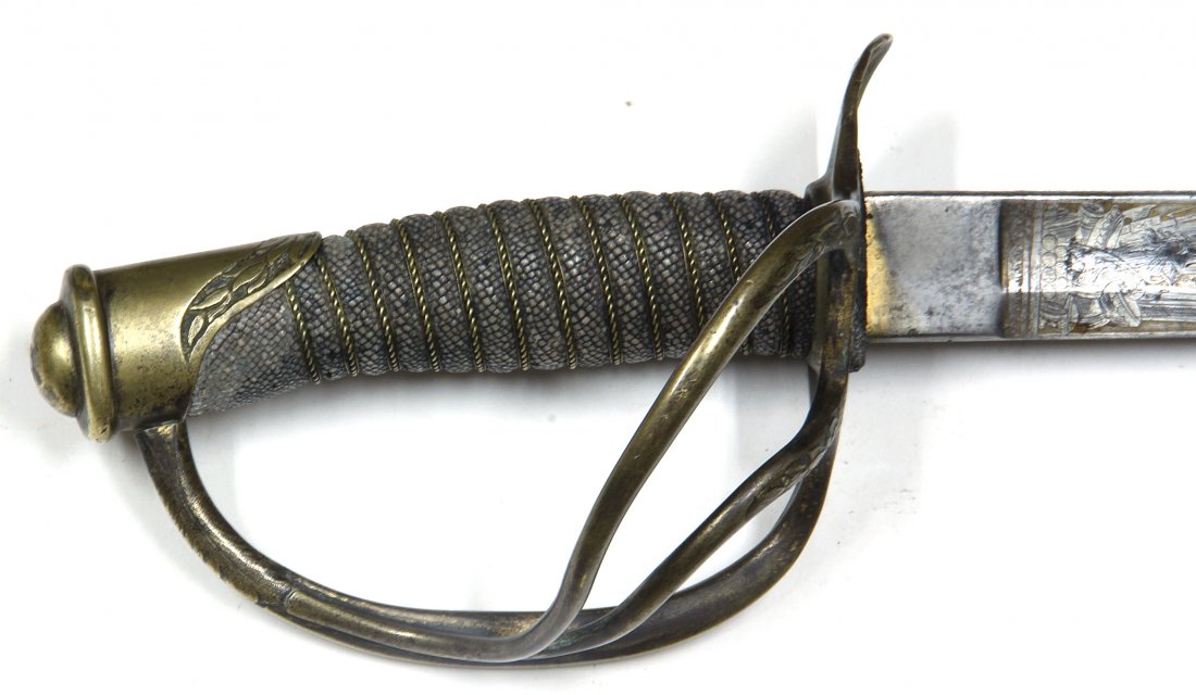 Civil War 1860 Cavalry Officers Saber Gold washed blade: Most cavalry officer's sabers we find are the heavier pattern of 1840. This one is the 1860 pattern light cavalry model with the rounded spine on the blade and swelled center area of the grip. Far rar