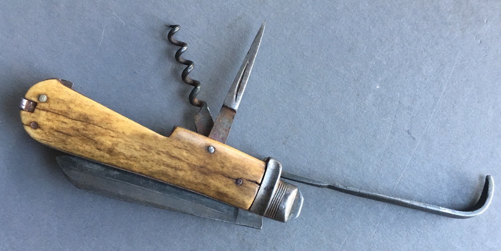 HAWKSWORTH COMBINATION FARRIER: Nice Civil War period combination farrier's knife with large and small blades, hoof pick and screw. Edge nicks to main blade. Nice markings. 3 1/2 inches closed. 5 7/8 inches with hoof pick extended. 