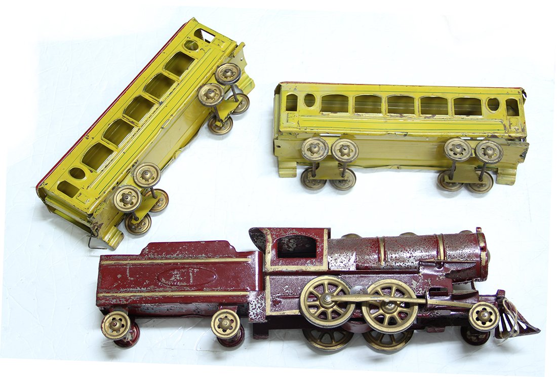 3 Foot Long Antique Tin Toy Train: Likely 1930s or 1940s era. Loads of charm. Engine and tender are red. Cars are yellow with red roofs. Perfect Christmas gift for the antique toy or toy train collector on your list. The passenger cars