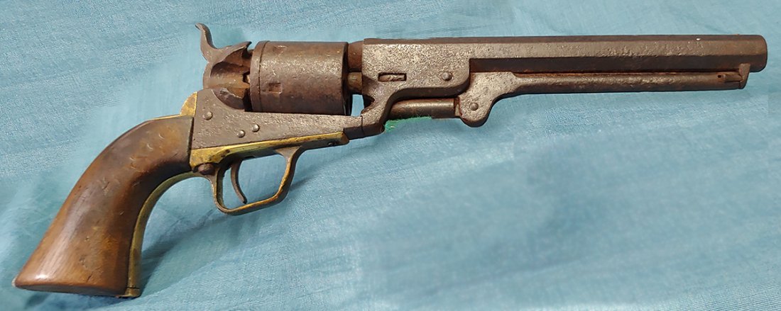 Real Wild West Colt Navy Conversion: Wonderful unmessed with relic Colt totally brown and pitted and cool. This great old six shooter is really trying to tell us the story. It is the Colt model 1851 navy revolver. It undoubtedly saw good