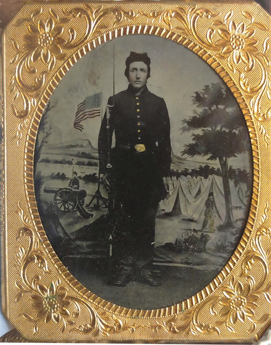 Civil War tintype armed patriotic backdrop: Tintype, sixth plate in half case. A very sharp armed image. My collection note says it accompanies some items owned by George W. Hall. I don't recall the items but am looking. The back of this image 