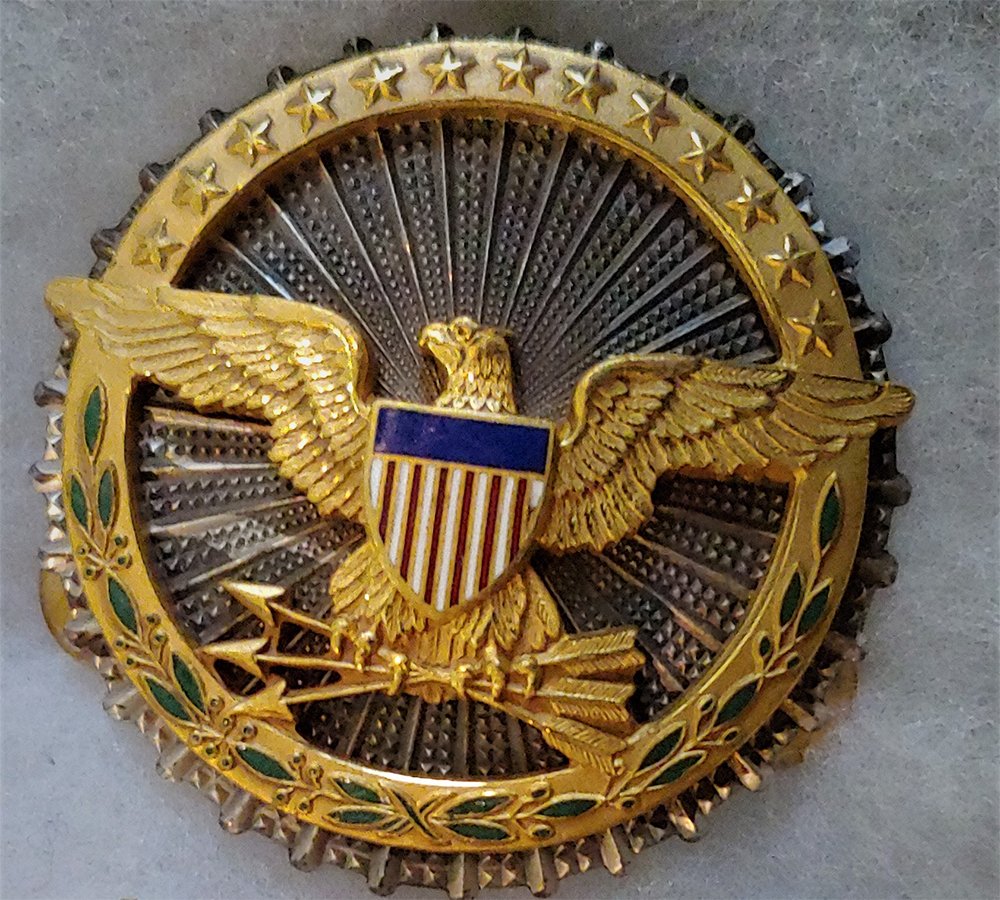 Silver US Secretary of Defense Service badge N S Myer: Excellent condition. Marked Sterling and signed by NS Myer. Korean War or Vietnam. Myer has been out of business for decades. Can be mailed in a small box for $9.00. Optional Insurance is $1.50 per hu