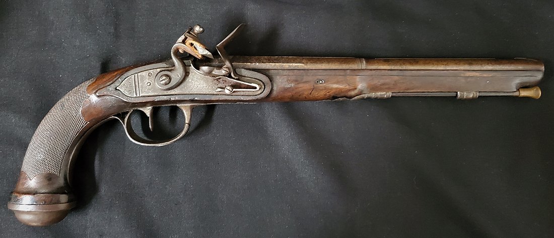 18th Century Flintlock Pistol: -NO RESERVE-A long barrel French flintock holster pistol dating about 1790-1815. Barrel length 11.5 inches. Bore roughly .52 caliber. The wood has nice edges and sharp checkering on the grip. The hamm