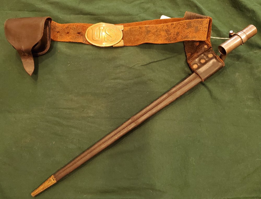 CIVIL WAR UNION INFANTRY BELT RIG: -NO RESERVE-An original Civil War infantry belt rig consisting of the leather waist belt with oval US belt plate and flat brass C-claps keeper, a percussion cap box, and bayonet with scabbard. The bel