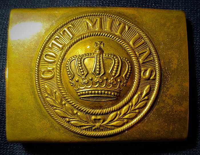 German Belt Buckle World War One: Very good condition German WW1 belt buckle. Hooks in place on reverse. Face with Gott mit uns around a raised crown at center. This can be shipped/mailed by US Mail for $8.00. Insurance is $1.50 per $