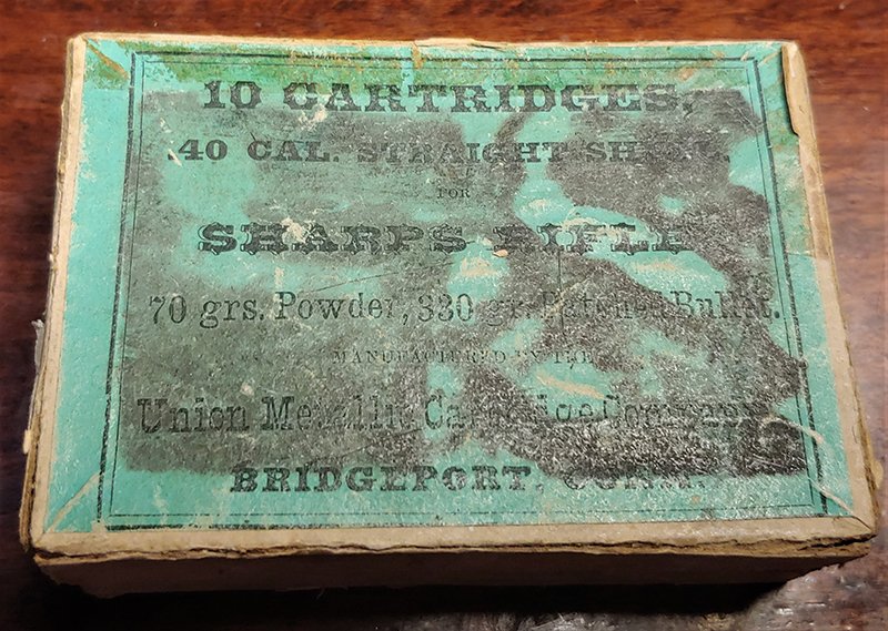 Pkg For Sharps Rifle Cartridges: Box w label for 40/70 Sharps rifle cartridges. Box contains bullets to be reloaded. See other similar lots. One section of lid is missing...................................................... This can