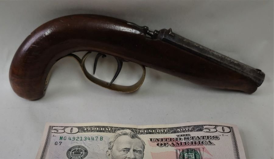 1840-1860 Percussion Gallery Pistol @ 18 caliber: Really a great early gun made to shoot INDOORS. This fired a small bullet .18 to .20 caliber using only a percussion cap as propellant. Has fine quality double set triggers meaning it was intended to 