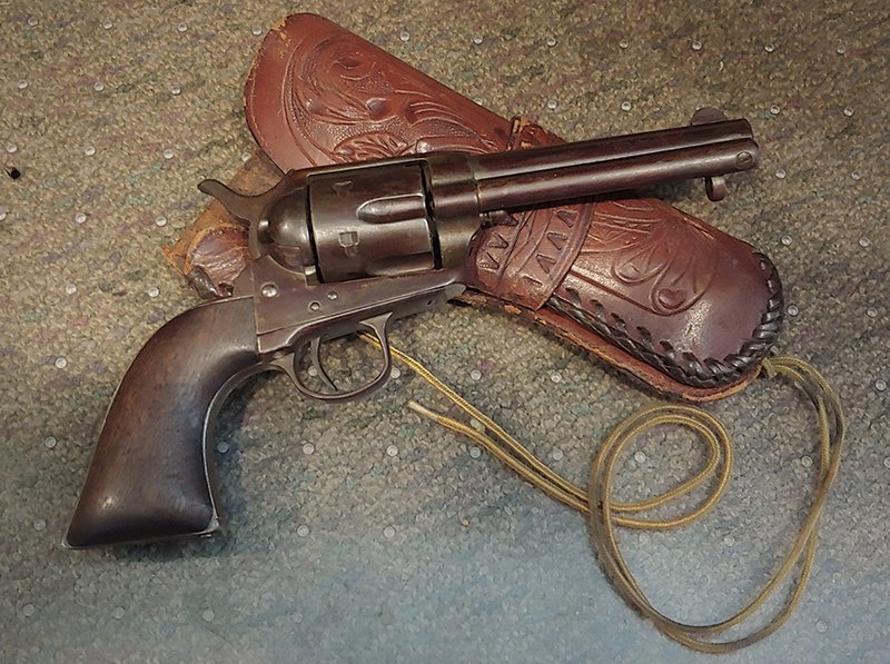 1877 Colt Single Action Cowboy Revolver 1877: A real Colt cowboy six shooter made one year after the Custer Massacre. .45 caliber. All matching serial numbers, mechanically perfect, with no repairs or replacements. Has factory letter from 1963 to