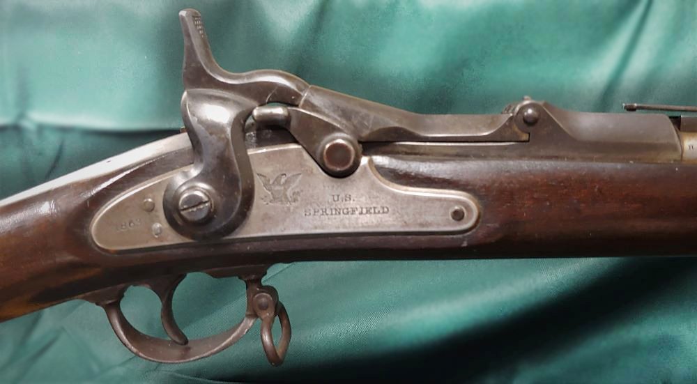 Springfield Model 1868 50/70 Trapdoor Rifle #39,001: Made at Springfield as an improved breech loader, these still utilized some left over Civil War parts. The 50/70 caliber trapdoor was the forerunner of famous Model 1873 used by Custer's boys. VG cond