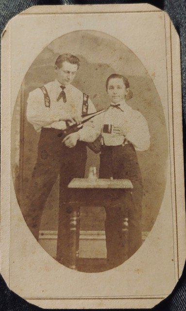 Fort Wayne Indiana odd unusual photo drinking?: Another unusual CDV photograph. Looks to me like dad is serving his young son a glass of booze. I suppose it might be a father son magic act with a bottle and glasses. But I will let you decide. The b
