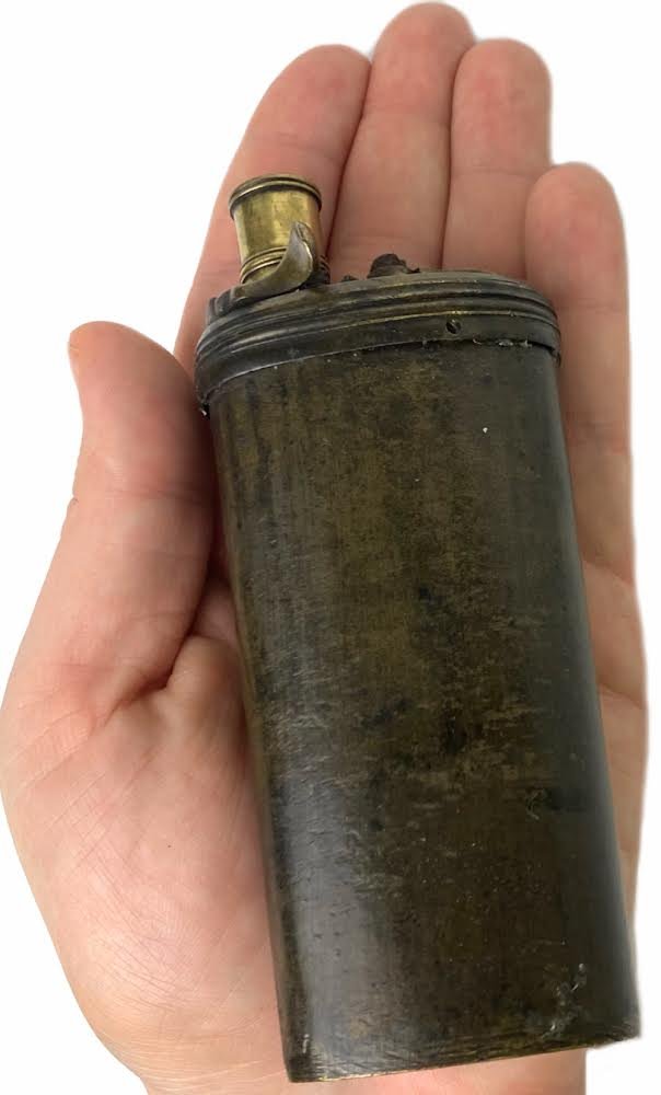 1840s Powder Flask with Ball Compart: This is a fine combination flask for a percussion pistol of the 1840s era. Measures 4 3/4in long & 2in wide, it is oblong in cross section and carries a fixed spout with thumb latch and spring in plac