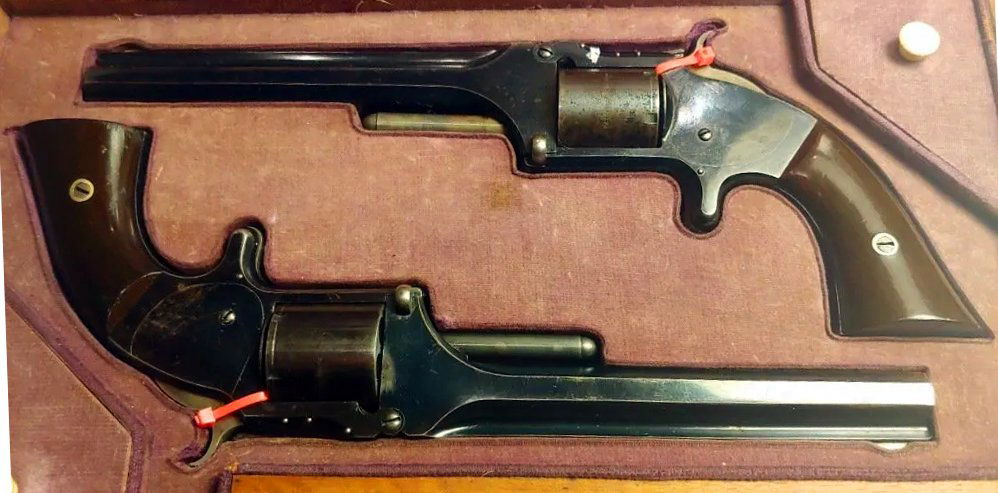High finish matched pr cased Smith & Wesson revolvers: Absolutely superb matched pair of Smith & Wesson Number 2 Army revolvers in their original 1860s retailer French style form fitted velvet lined casing. This box and guns have been together for 146 yea