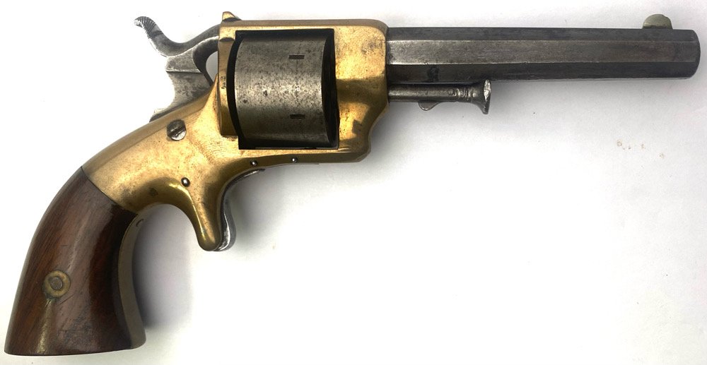 1860 Prescott Pocket Model Revolver: This E.A. Prescott rimfire revolver has a short frame, but uses the cylinder pin with the locking device on the pin itself and the locking notches on the front of the cylinder, rather than the rear, w