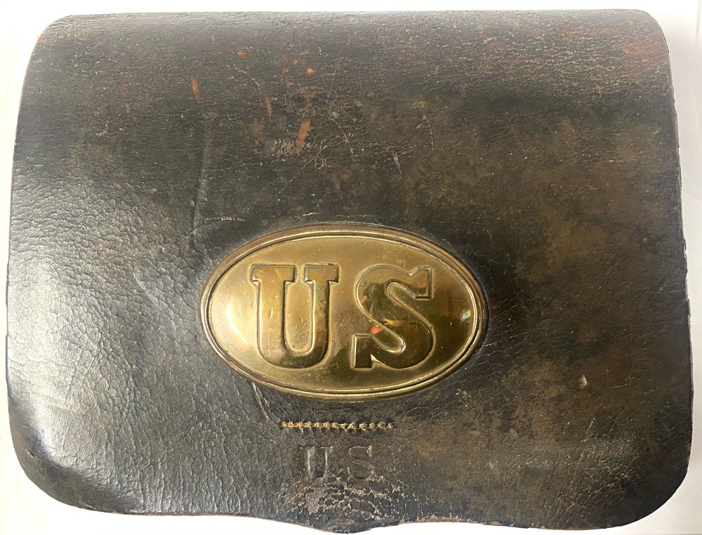 US Cartridge Box by CS Storms with box plate: Top notch early war example. Regulation Civil War 1861 pattern cartridge box for the .58 caliber rifle musket, with a small US stamped on the lower front flap and maker marked on one side by C.S. Stor