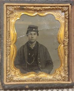 Ambrotype Civil War Soldier: Ninth plate ambrotype of young uniformed Union army soldier housed in a half case. Very good condition with one ripple in the emulsion. As with all my items No Reserve. Materials, Packing, and Shippin
