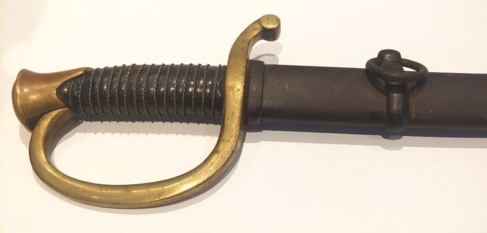 Civil War Artillery Saber by Ames Dated 1862: Regulation Model 1840 saber for light artillerymen made and dated 1862 by Ames. Complete with full scabbard, nice leather grip wrap and wire in place. Clear Ames maker markings along with inspector in