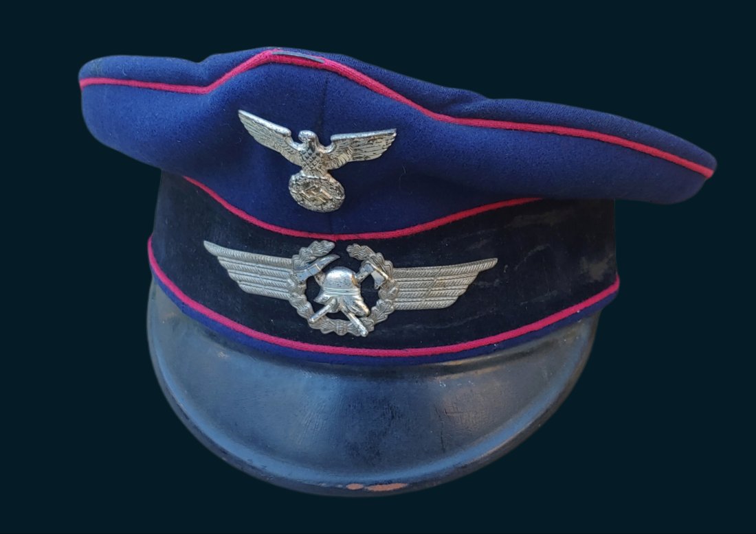 WW2 German Fire Police Coat and Cap uniform: Hitler's Third Reich Feuerschutzpolizei or Fire Protection Police was formed in 1938-39. This is an early period blue uniform coat and cap. Excellent overall original condition with proper insignia. I