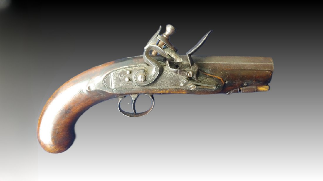 Flintlock pistol: Ca 1820 English flintlock coat pistol. 10 inches overall. 56 cal. Very handsome and exhibiting good quality and attractive engraving. Lock is signed Sutherland. The barrel is marked Richmond which bri