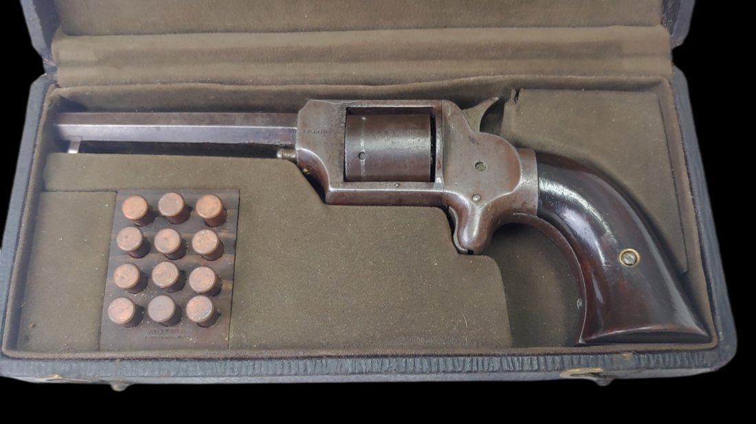 Civil War Uhlinger Revolver in Box JP Lower Denver: Standard 1860s Uhlinger 32 caliber rimfire revolver in fair to good condition. Lacks loading gate and ejector rod, otherwise very good. This is housed in a late 1800s form fitted leatherette case. In 
