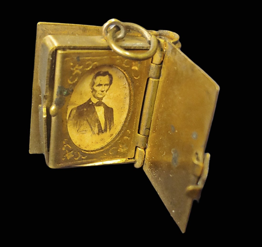 Tiny 1860s Miniature photo album Beardless Abraham Lincoln: Locket, charm, jewelry, 1860s political, Civil War, ... all apply to this wonderful little gem. This tiny miniature photo album contains two separate pages that look like daguerreotype frames. The ori