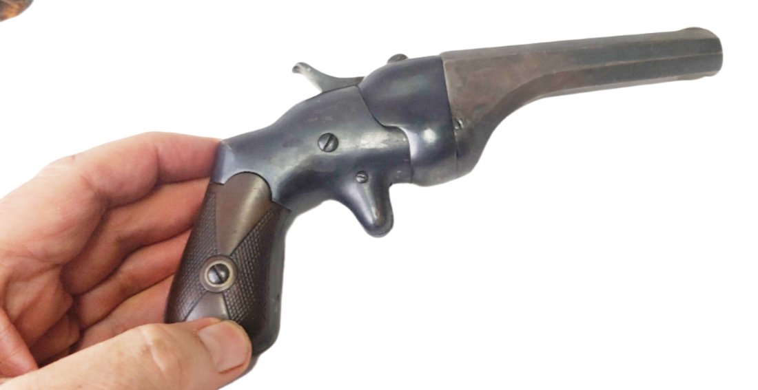 1864 Hammond Bulldog pistol: Hammond Bulldog is a single shot rimfire pistol patented by Henry Hammond in 1864 during the Civil War. It is chambered in 44 rimfire.The Hammond Bulldog pistol has a swivel breech for loading. Approx