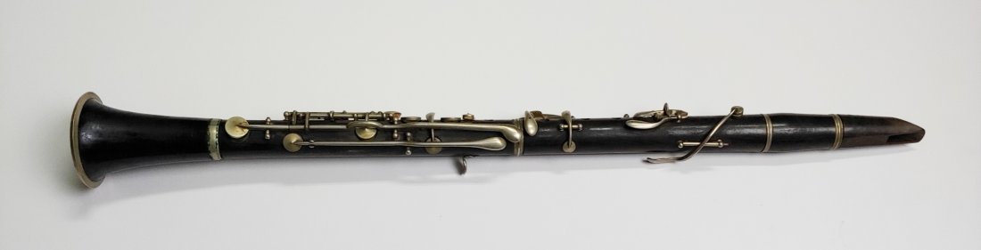19th century clarinet: Old time clarinet that came in a collection I bought. I know virtually nothing about it. The pictures will tell you what I cant. Materials, Packing, and UPS Shipping on this item is $25.00. Insurance 