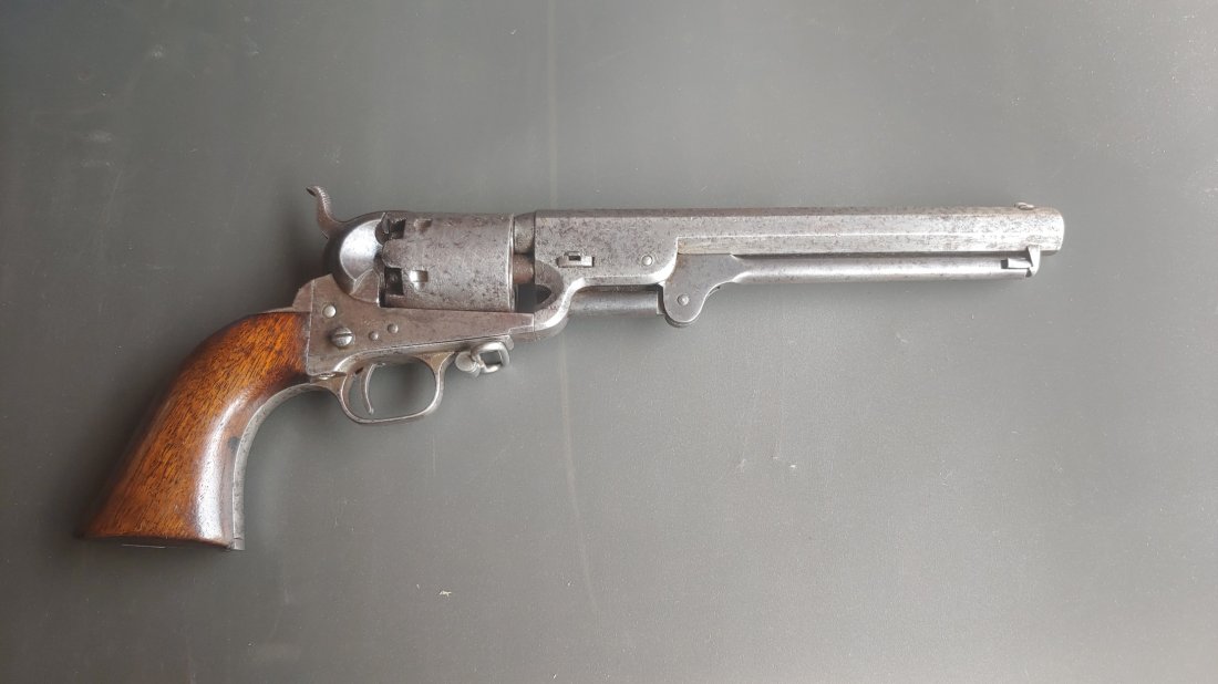 4 Screw Steel Strap Colt Navy cut for stock with swivel: One of the rarer Colt revolvers in the collecting world is this 1851 Colt Navy revolver with 4-screw frame which is cut for a shoulder stock in the frame and on the butt strap. Further, this gun has a