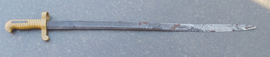 Civil War Merrill rifle saber bayonet: Quite a scarce CW bayonet. Fits the Merrill Infantry rifle. Good solid used condition. Blade is a bit rough. Brass handle is VG and bears the serial number. Just the bayonet no scabbard. The rifle sho