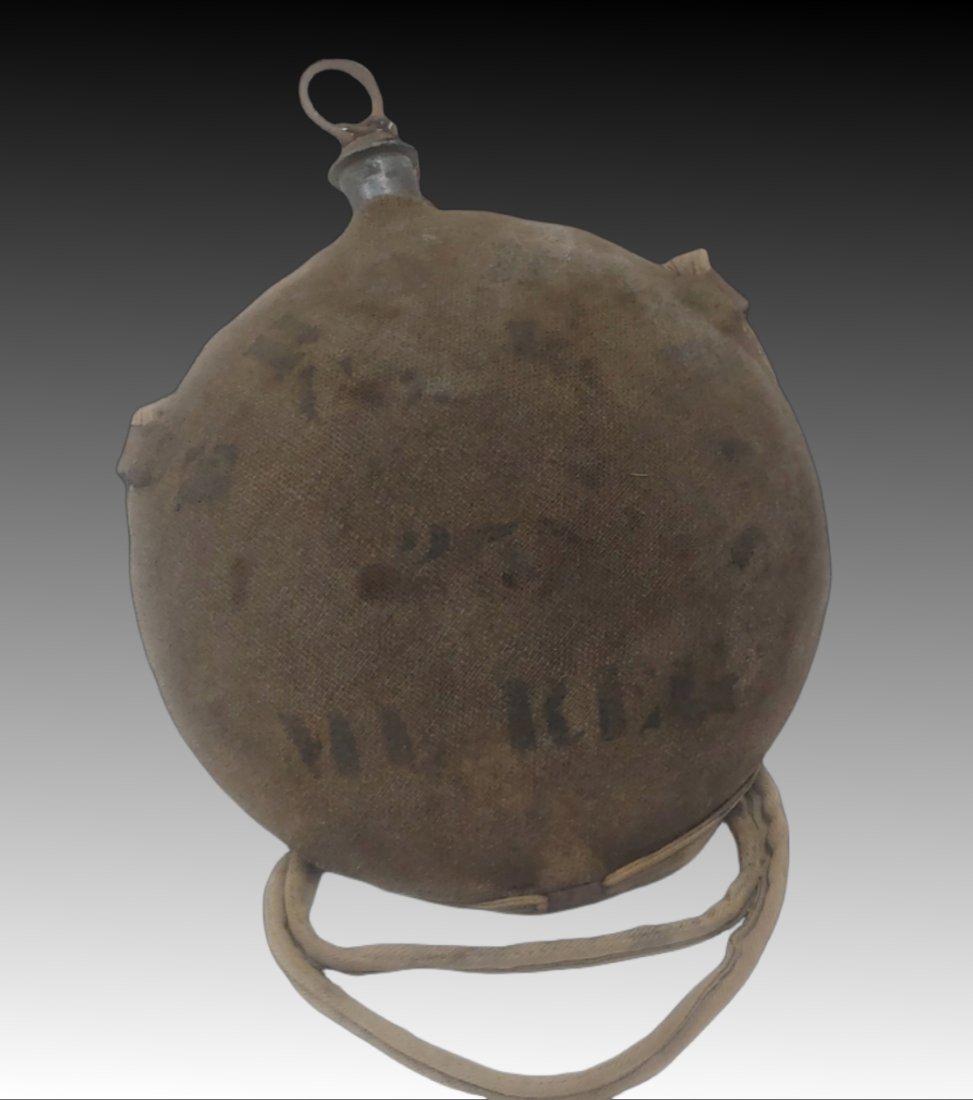 25th Maine Civil War soldiers canteen: Fully identified in stencil on the cover and complete with the shoulder strap, stopper, and chain. Marked E. ROBERTS Co. I 25th ME. REG. This being Edwin Roberts, Cape Elizabeth, ME. 22 years old. Enl
