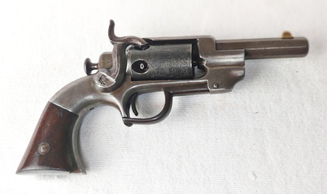 Allen and Wheelock Revolver: Allen and Wheelock percussion 31 caliber revolver. Side hammer. 4 inch barrel. Rammer functions via trigger guard. Hammer screw is sheered off. The hammer cocks. The cylinder does not index regularly.