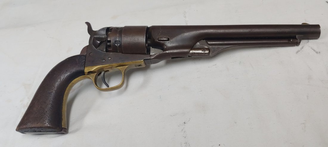 Civil War 1860 Colt Army revolver: The Colt 1860 packed a .44 caliber punch and was the standard sidearm for US cavalry. This is a darn nice example, with attic brown patina on the smooth metal and with sharp grips showing a faint insp