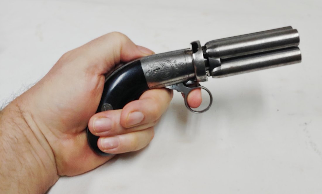 French Mariette 4 Barrel Pepperbox pistol: Fine condition four barrel French pepperbox pistol. This was made by G. Mariette or is a perfect knock off of his work. Ring trigger cocks and fires the gun. Barrels are damascus steel, each numbered 