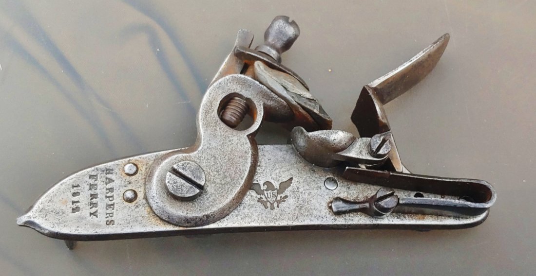 Harpers Ferry 1812 dated Flintlock lock: Here is a darn rare gun part. An excellent condition War of 1812 original musket lock for the Harpers Ferry flintlock musket. All original and complete. Mechanically perfect. Rare rare rare with the i